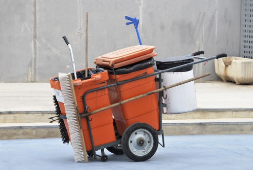Worker performing a pre-start vehicle safety check before skip delivery