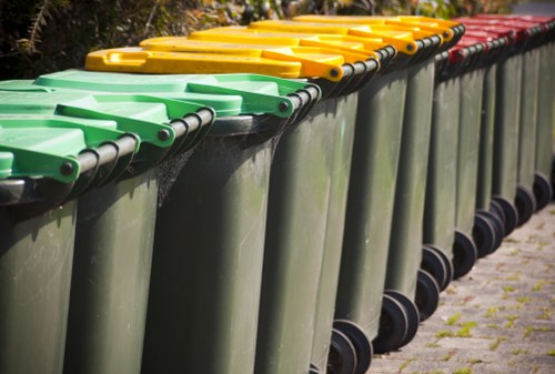 New Cross community members disposing of hazardous waste at a local collection point.